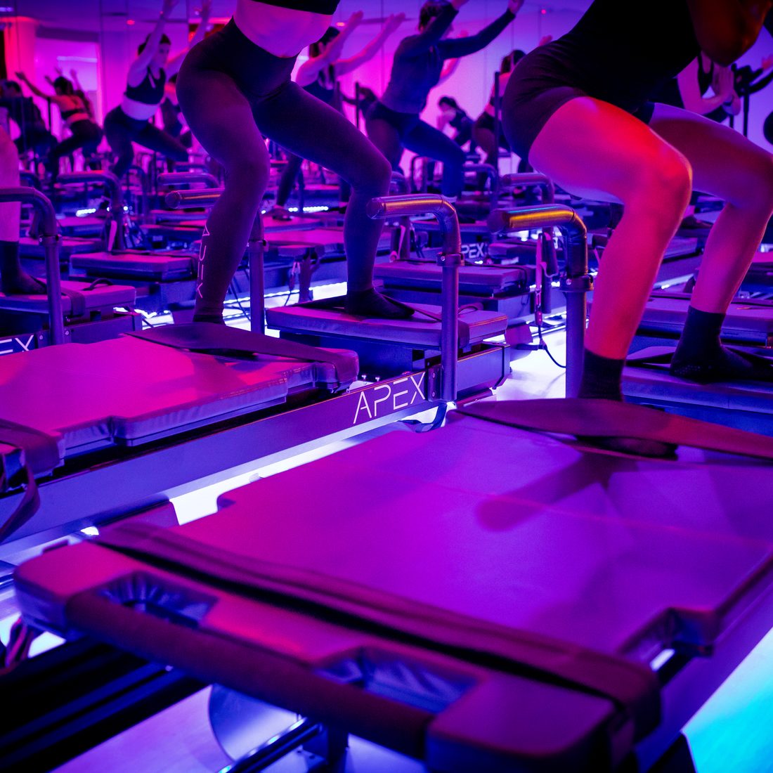 APEX class in a heavy squat hold on the Xformers